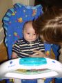 2005-03-27 carefully studying the bouncy chair